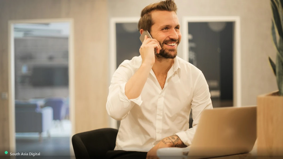 Business professional taking a phone call, representing Google Ads leads for Riyadh businesses